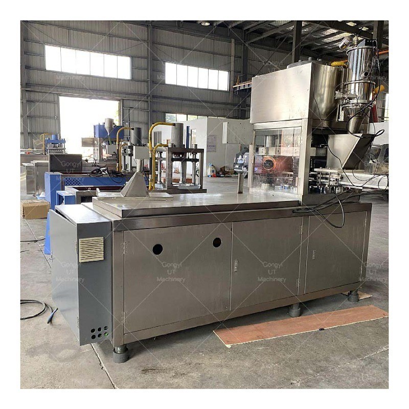 Machine d'emballage de produits ronds et irréguliers avec système hydraulique automatique